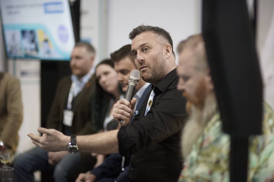 A panellist making a point on the Liquid Academy Live stage